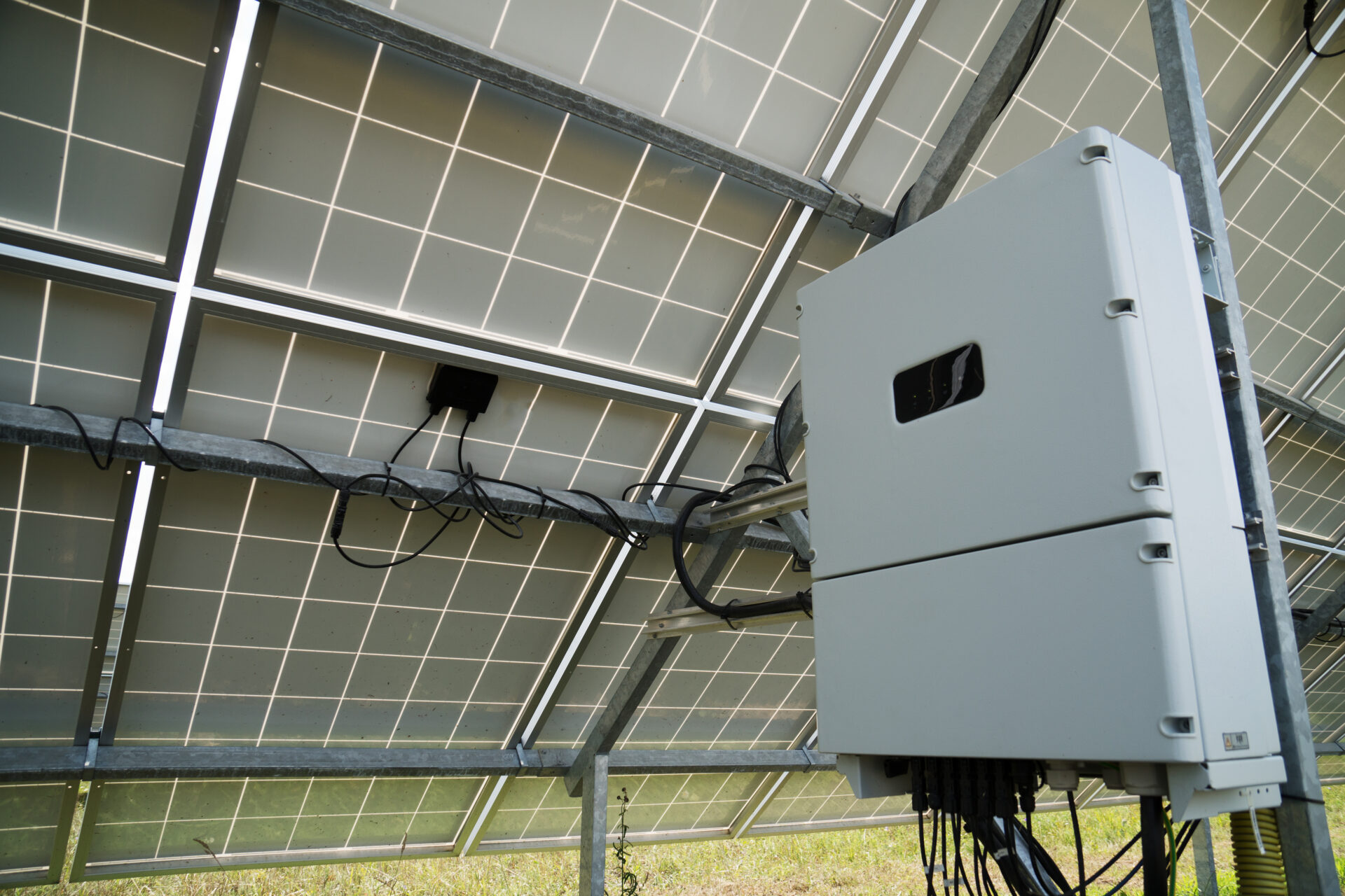 Inverter Behind The Solar Panels. Renewable Energy.