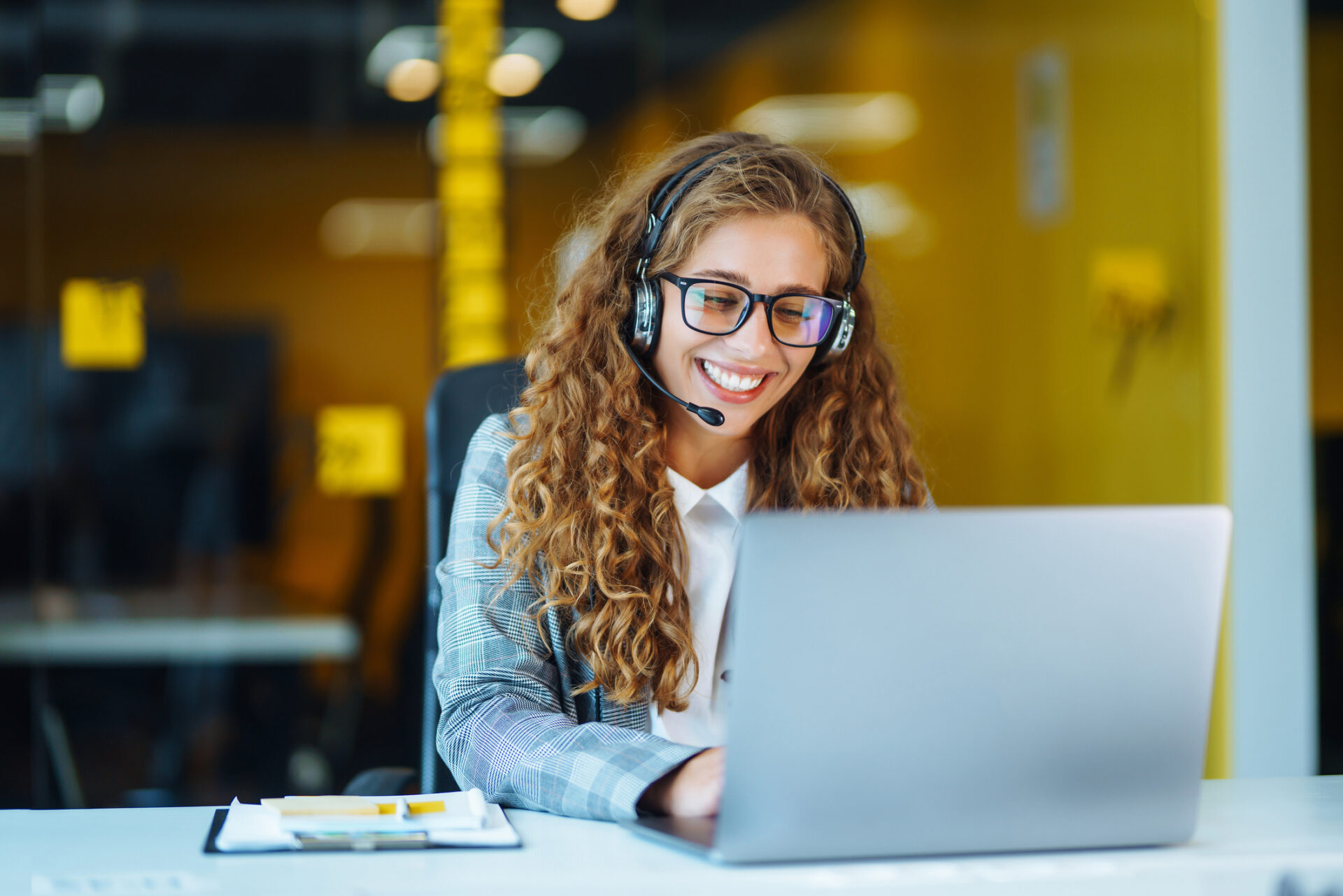 Call Center Agent With Headset Working On Support Hotline In Modern Office.