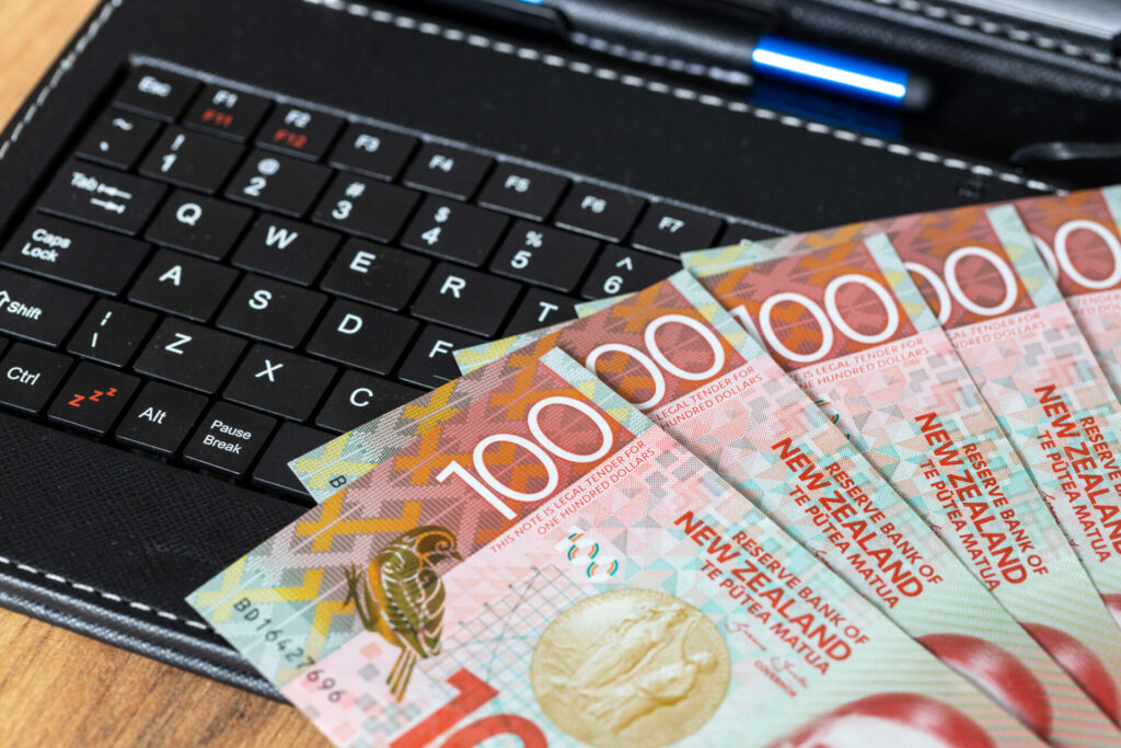 E Commerce Business, New Zealand Money On Tablet Keyboard, One Hundred Dollar Bills, Online Shopping And Shopping, Concept, Online Marketplace, Payment And Bank Transfer